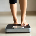 a person checking their weight