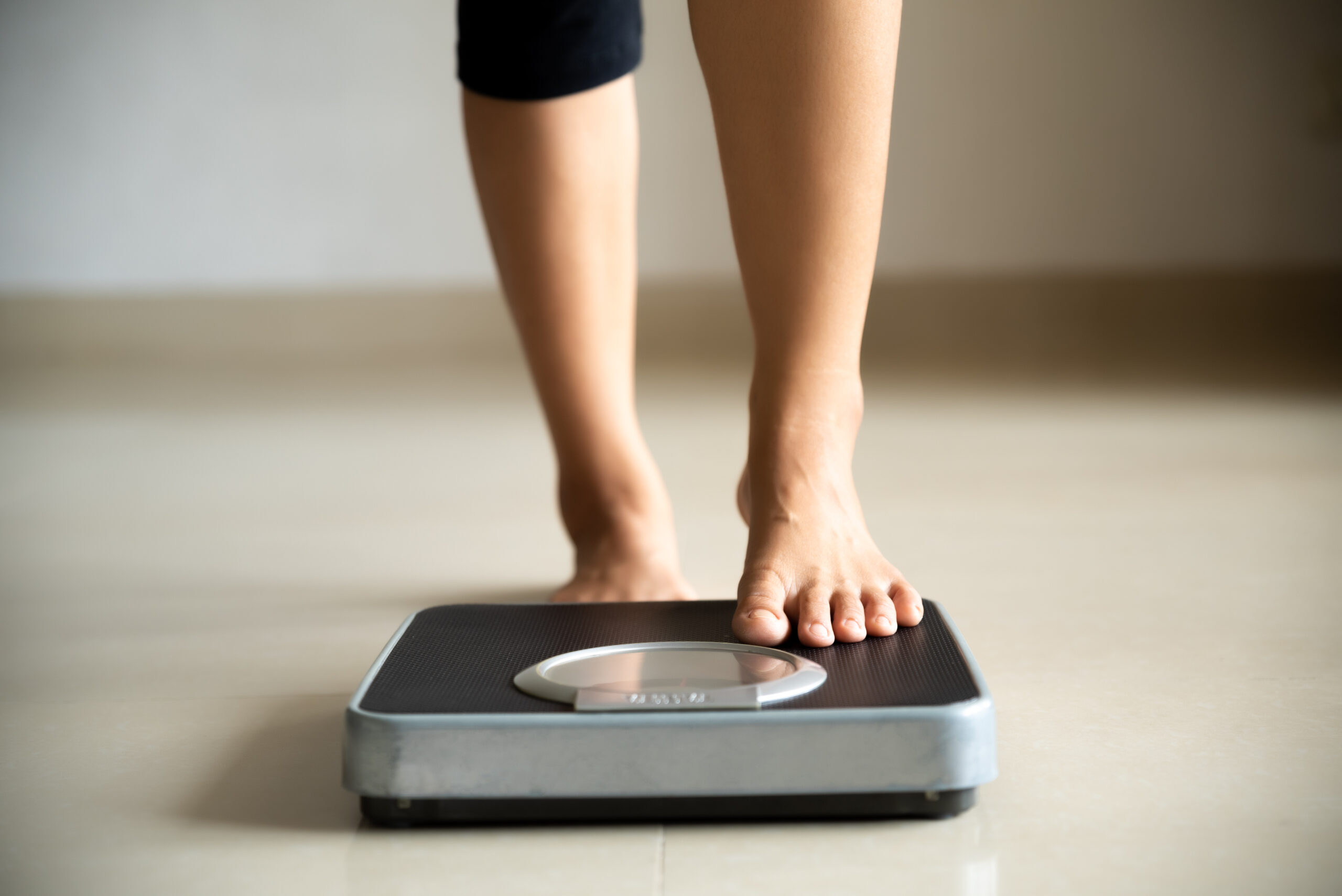 a person checking their weight